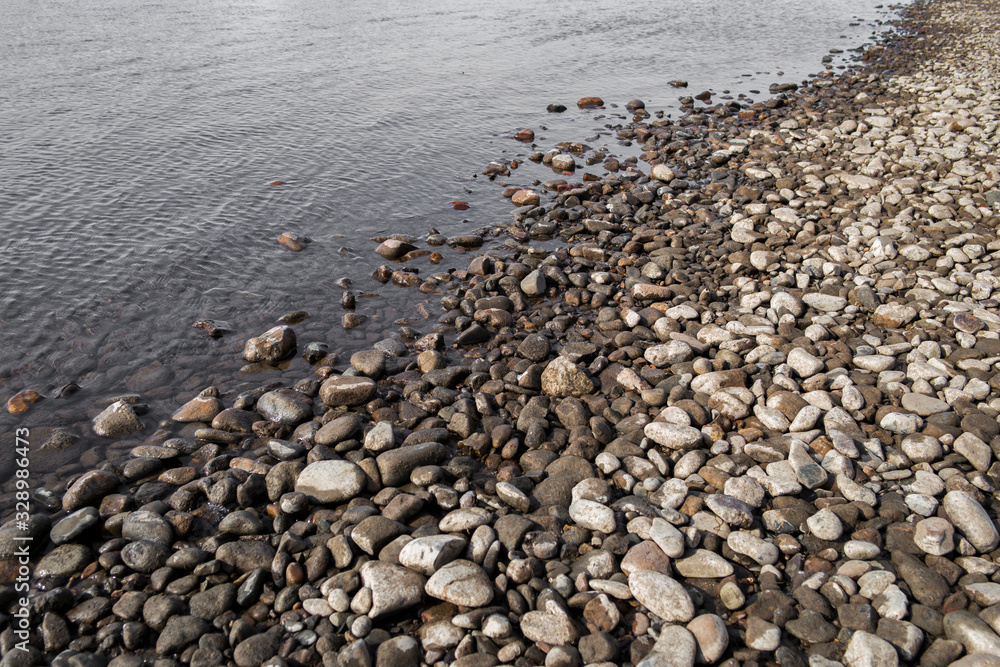 Pebble stone background. Sea Pebble. Beach stones. Natural background. Stone texture. Coast Pebble stone background. Sea Pebble. Beach stones. Natural background. Stone texture. Coast