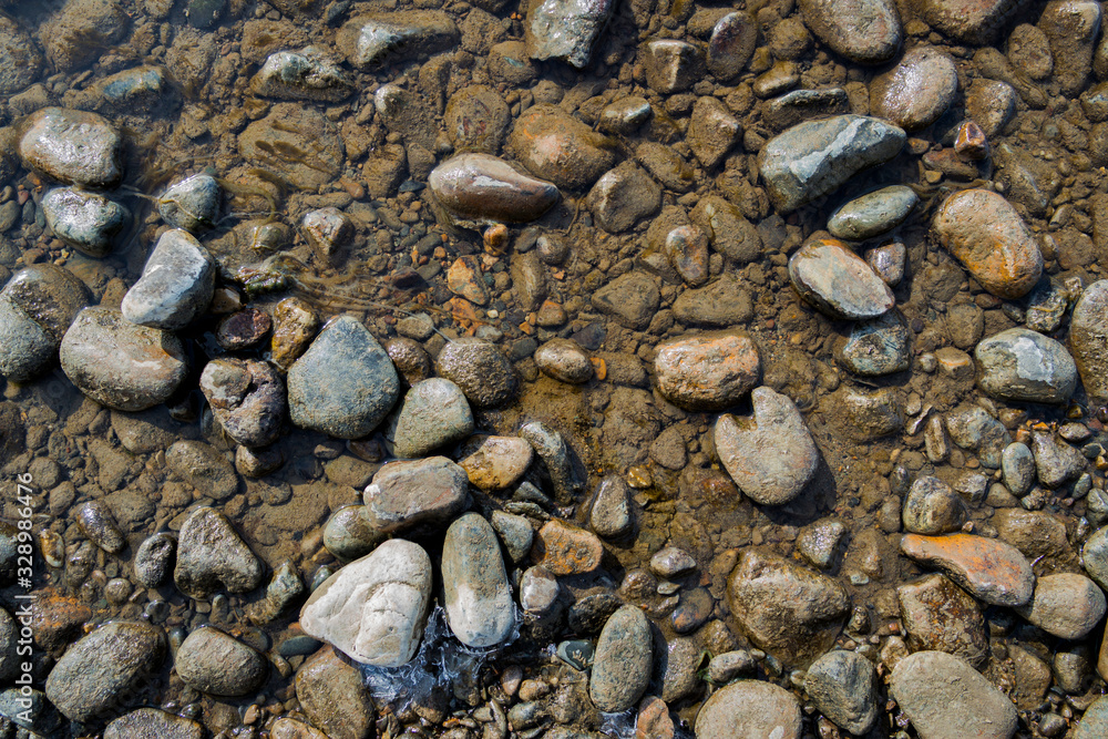Pebble stone background. Sea Pebble. Beach stones. Natural background. Stone texture Pebble stone background. Sea Pebble. Beach stones. Natural background. Stone texture