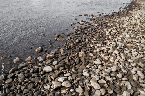 Pebble stone background. Sea Pebble. Beach stones. Natural background. Stone texture. Coast