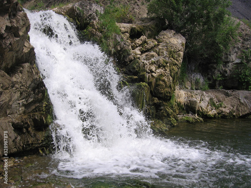 Fototapeta Naklejka Na Ścianę i Meble -  mountain waterfall in the rock water flow scenic natural view