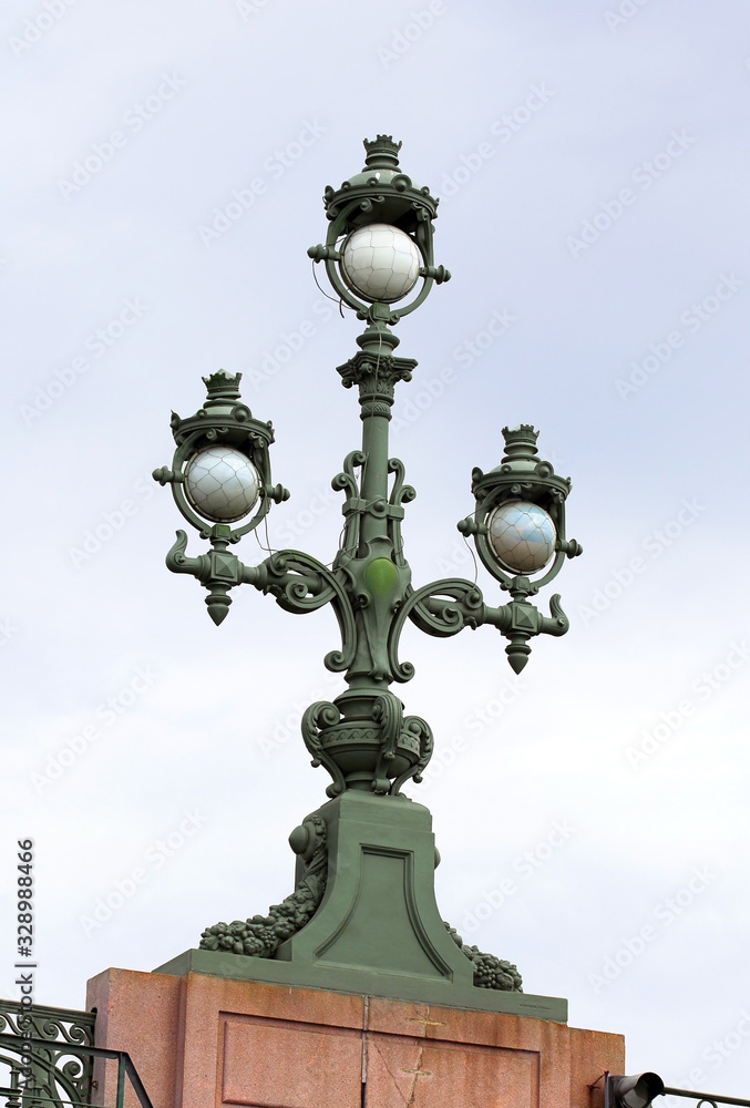 Cast-iron street lamp on the bridge