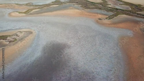 Aerial tilt down shot over dry marshes in the south of Spain.