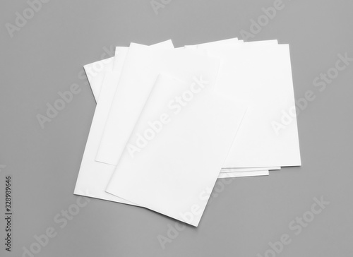 Blank portrait A4. Mock-ups sheets white paper isolated on gray background. can use banners magazine products business texture newspaper.