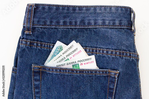 jeans pocket with paper thousands of Russian rubles