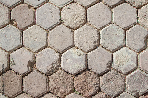 Paving stones. Old road wall background.