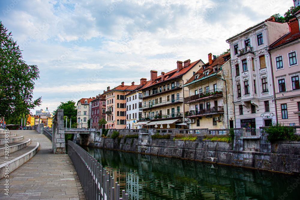 View to the shores and the river Ljubljanica in the center of city of Ljubljana during nice summer day