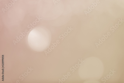 Abstract bokeh sparkle on yellow and gold background