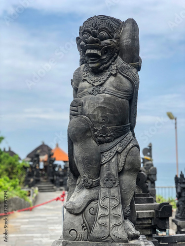 Bali, Indonesia - April 2019 : Walking at Tanah Lot Temple cliffside while waiting for Kechak Dance performance.