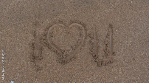 Slika na platnu The words I love you on the sand, an expression of love for my dearest