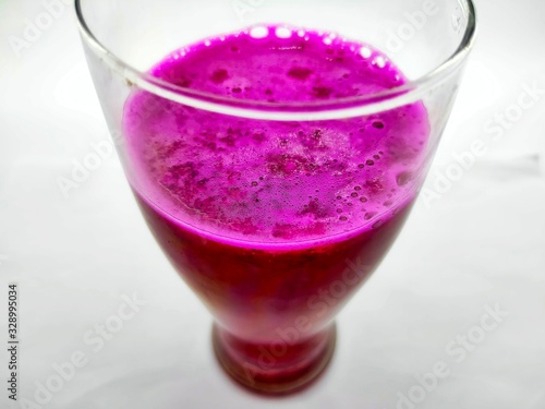 A glass of red dragon fruit juice
