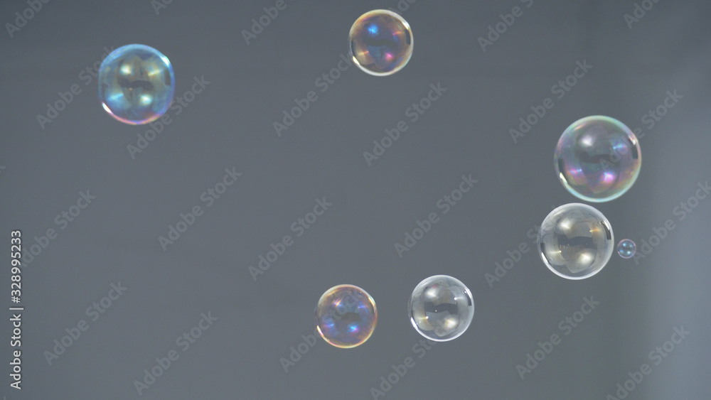 Soap or shampoo bubbles floating in the air by wind blow which represent refreshing and relaxing or joyful mood and tone and shoot in clear background in studio lighting set.