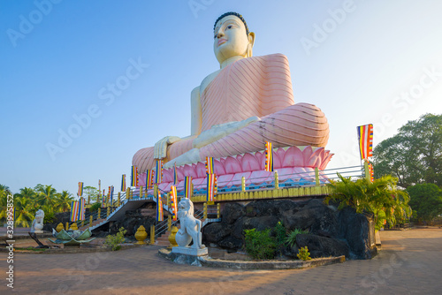 A giant sculpture of a seated Buddha in the Kande Viharaya Temple, Aluthgama. Sri Lanka photo