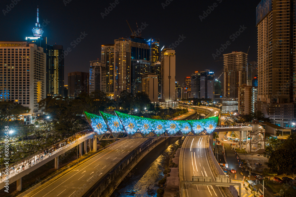 Kuala Lumpur, Malaysia - February 28, 2020 : Aerial drone view of newly opened pedestrian bridge Saloma Link connecting Kampung Baru with Ampang road.