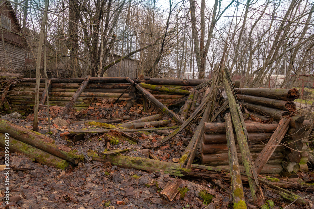The remains of a destroyed wooden building. The remains of a destroyed wooden building.
