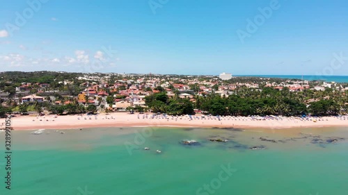 Drone flght from over the sea to Itapuã district in Salvador Bahia Brazil. photo