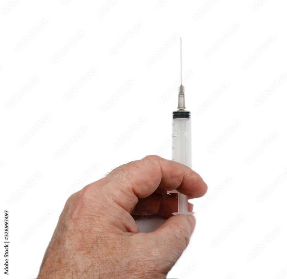 A medical syringe in the man 's hand. injection from a viral disease. A medical syringe in the man 's hand. injection from a viral disease.