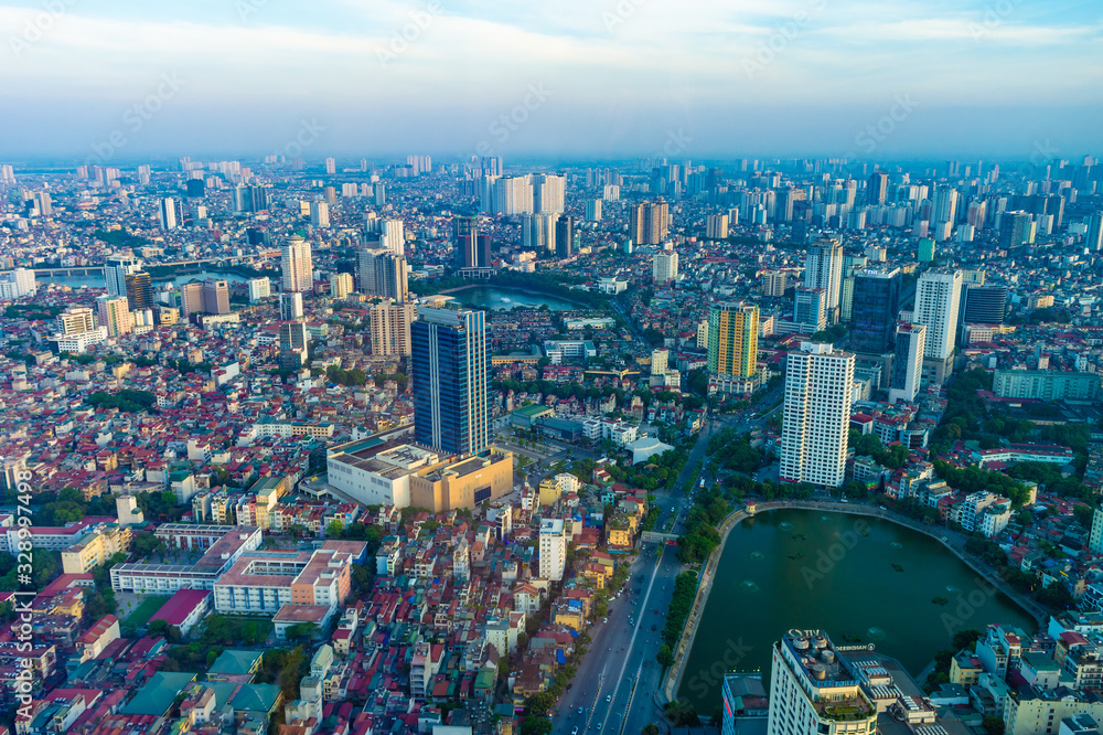 Obraz premium Hanoi, Vietnam - 22th June 2019: Hanoi cityscape at sunset, from Lotte Observation Deck in Lotte Center, Hanoi.