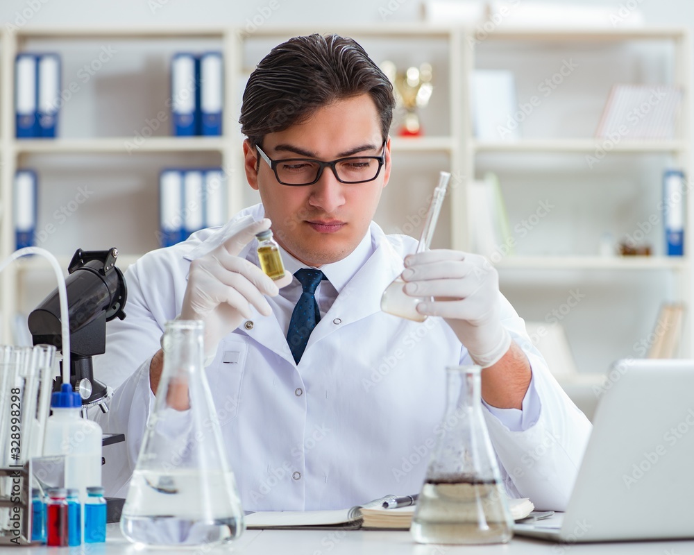 Young researcher scientist doing a water test contamination expe Young researcher scientist doing a water test contamination expe