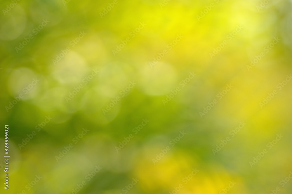 Fototapeta premium Abstract circular yellow green bokeh background