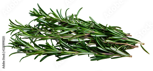 Green sprigs of rosemary on wooden surface