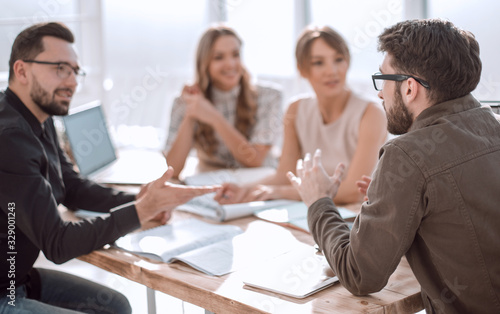 Canvas Print business partners hold a dispute at a meeting in the office