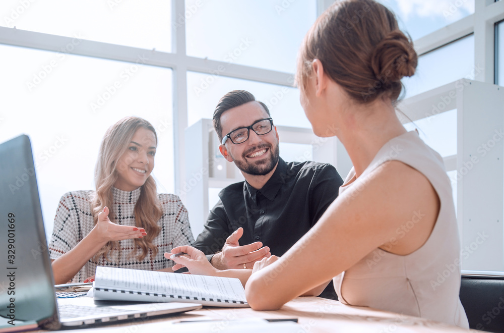 young business woman explaining her ideas at a business meeting. young business woman explaining her ideas at a business meeting.