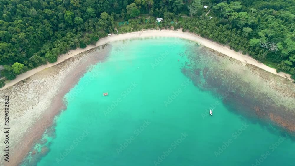 Aerial view of tropical sandy beach in bay with blue water. Seascape with sea, sand, palm trees. Top view of paradise island. Summer and travel vacation concept. Aerial view of tropical sandy beach in bay with blue water. Seascape with sea, sand, palm trees. Top view of paradise island. Summer and travel vacation concept.