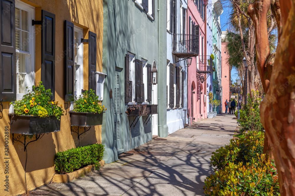 Rainbow Row in the morning, the name for a series of thirteen colorful historic houses in Charleston, South Carolina. 