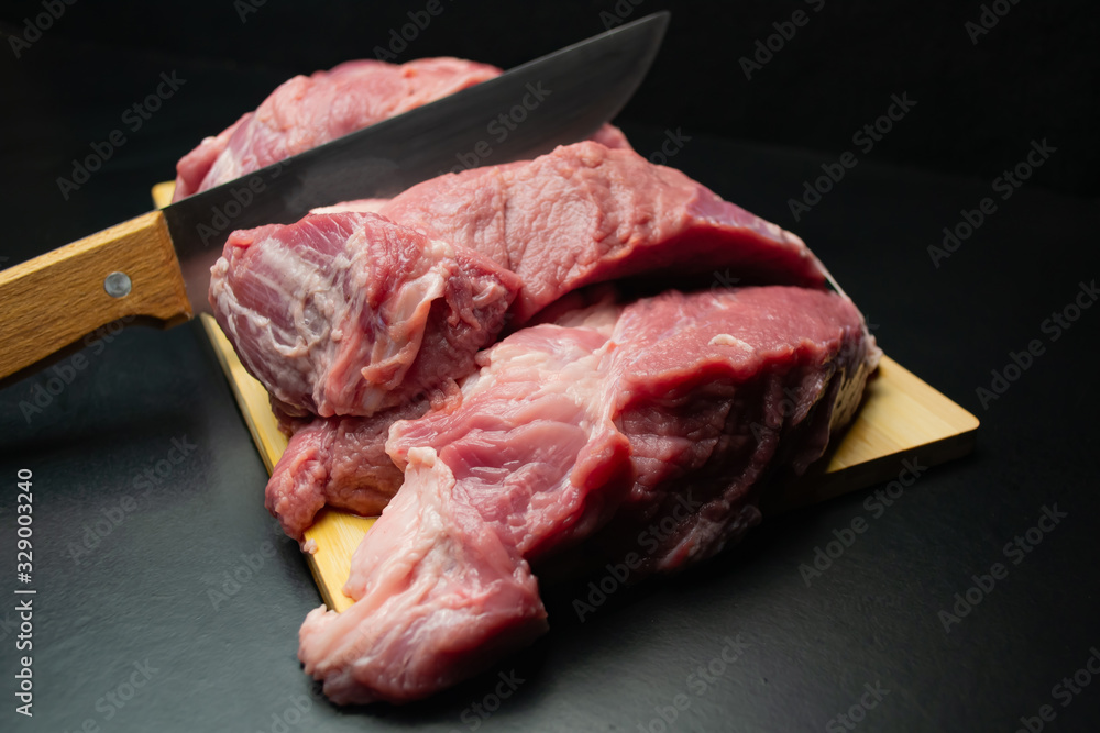  Fresh juicy meat cuts a knife on a cutting board