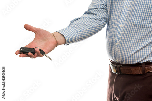businessman gives car keys to car isolated on white background.