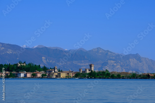 Sirmione island Lake Garda, Italy. In the background mountains and blue sky © Berg