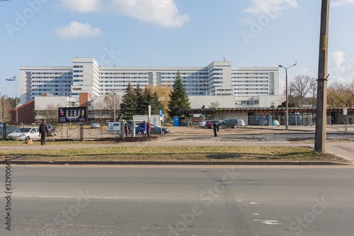 City Riga, Latvia. SHospital view and people are standing on the street waiting for public transport.
