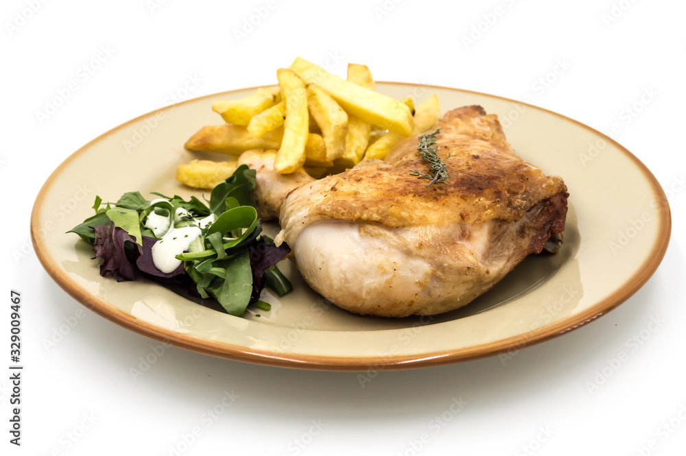 Roasted chicken leg with fries and vegetables Roasted chicken leg with fries and vegetables