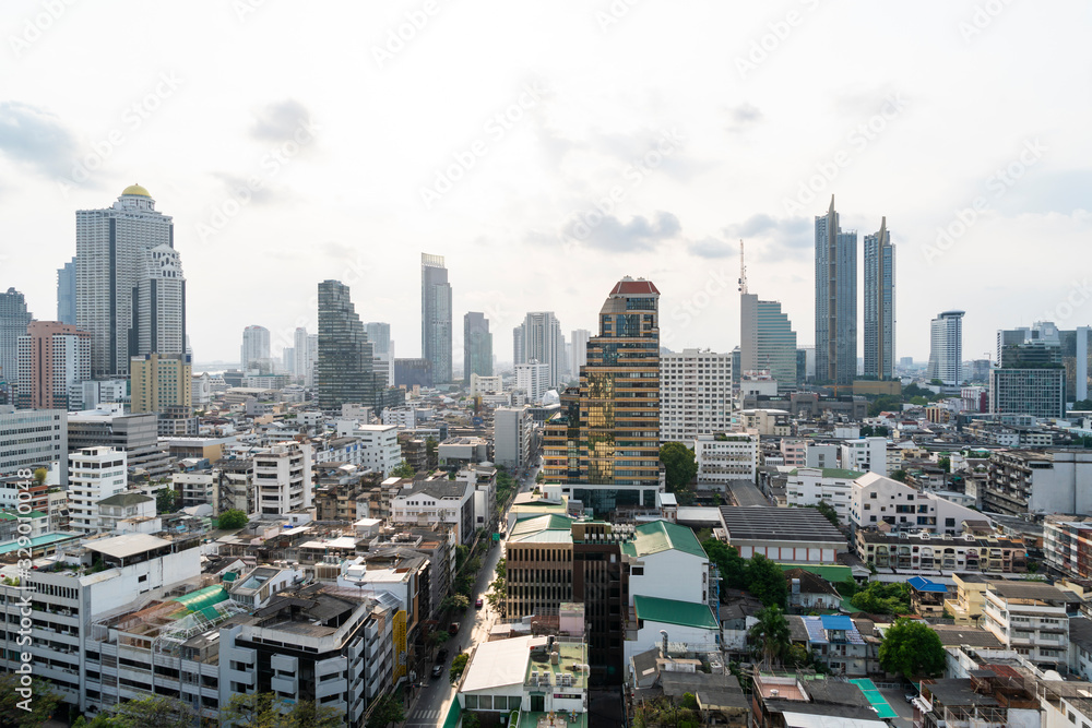 Cityscape of picturesque Bangkok at daytime from rooftop. Panoramic skyline of the biggest city in Thailand. The concept of metropolis. Unique Asia. Cityscape of picturesque Bangkok at daytime from rooftop. Panoramic skyline of the biggest city in Thailand. The concept of metropolis. Unique Asia.