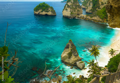 beautiful aerial view of tropical paradise beach and rock cliff with amazing turquoise sea water and palm trees in Summer holidays travel destination and exotic vacations trip