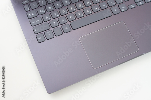 Closeup of silver laptop on a white background. View from above