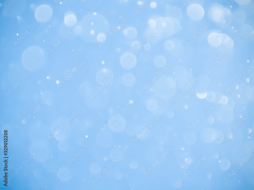 Abstract blue bokeh background.Blurred bright light. Abstract blue bokeh background.Blurred bright light.