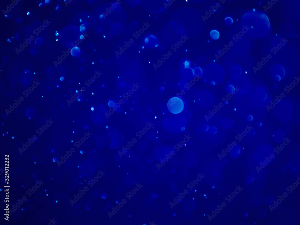 Abstract blue bokeh background.Blurred bright light. Abstract blue bokeh background.Blurred bright light.
