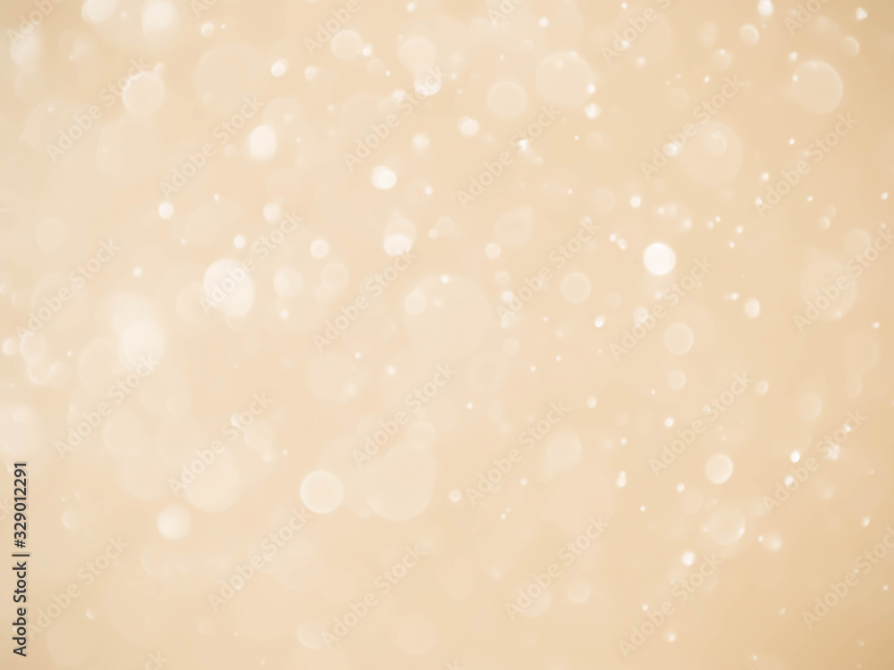 Abstract bokeh light on golden background.