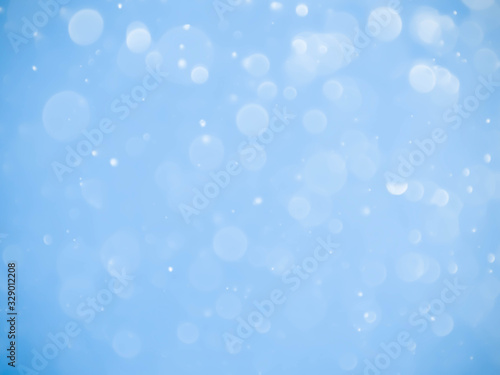 Abstract blue bokeh background.Blurred bright light.