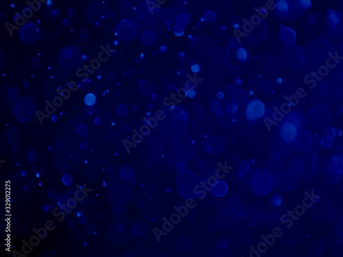 Abstract blue bokeh background.Blurred bright light. © K.PND4289