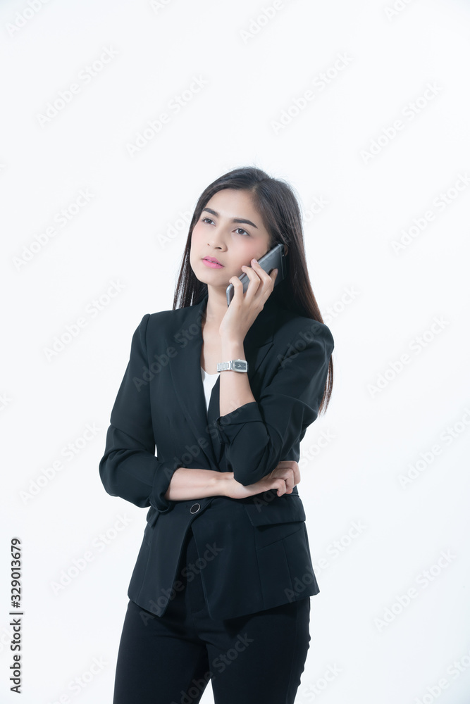 Asian Business women are using mobile and touch smart phone for Communication on white blackground Asian Business women are using mobile and touch smart phone for Communication on white blackground