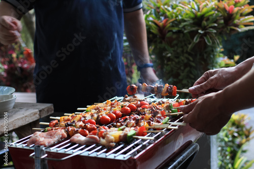 Barbeque Grill Street Food in thailand Eat outdoors in a happy family.