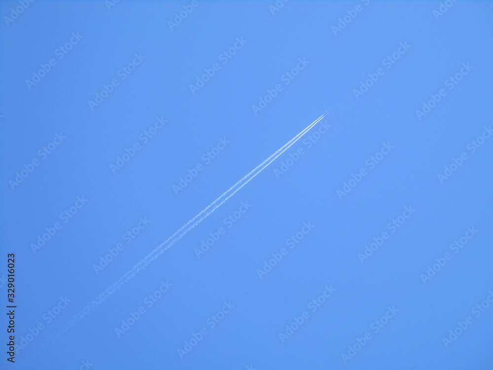 Plane flying in the clear blue sky Plane flying in the clear blue sky