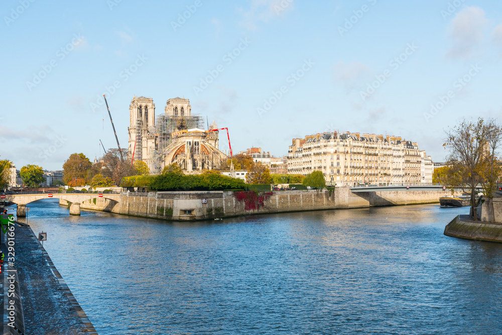 Obraz premium Notre-Dame de Paris, France. This gothic medieval monument caught fire on april 15 2019. Currently this catholic cathedral is being renovated (construction). Worldwide monument.