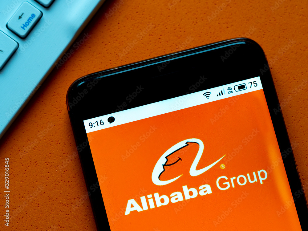 Foto Stock In this photo illustration the Alibaba logo is seen displayed on  a smartphone | Adobe Stock