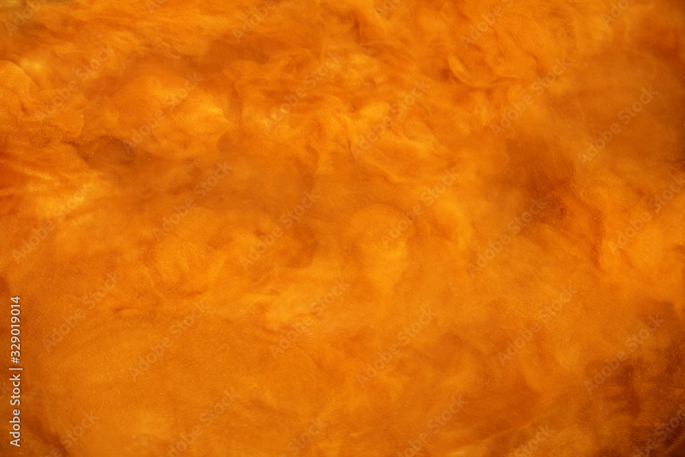 abstract blurred outlines of mixing substances. foggy orange mystery