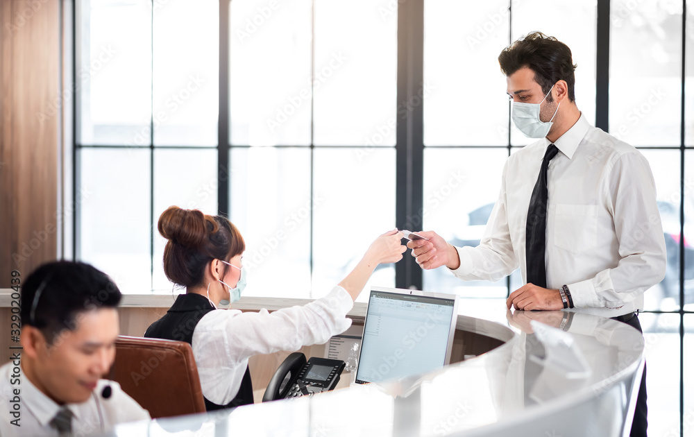 Reception Counter Services with Customer at Counter, Businessman Check in at Hotel Reception Reception Counter Services with Customer at Counter, Businessman Check in at Hotel Reception
