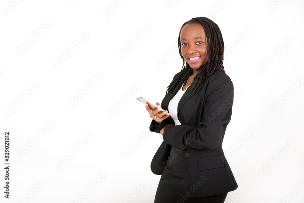 beautiful young african woman in a black suit with a phone in his hand on a white background beautiful young african woman in a black suit with a phone in his hand on a white background