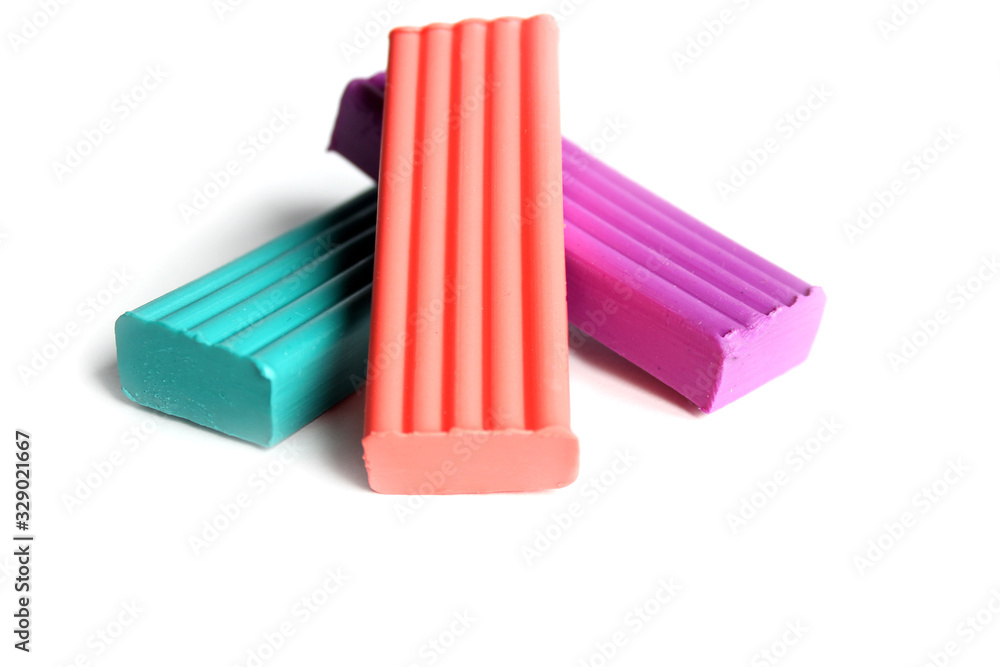 multi-colored plasticine on a white background. Educational games for children multi-colored plasticine on a white background. Educational games for children